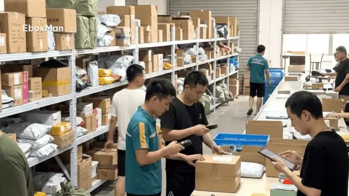 Chinese warehouse staff scanning parcels before international shipment