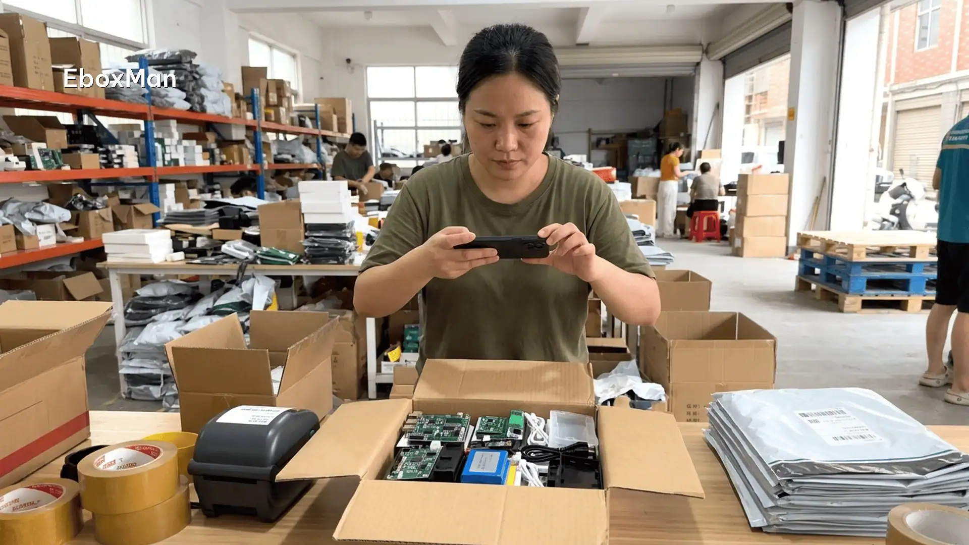 ROAS is lying to you: pricing by true landed cost 1 QC desk worker photographing products before dispatch