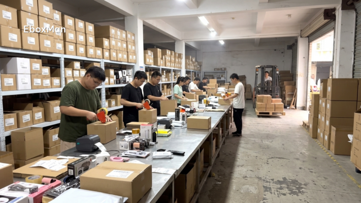 Warehouse staff packing private label boxes in a China fulfillment center