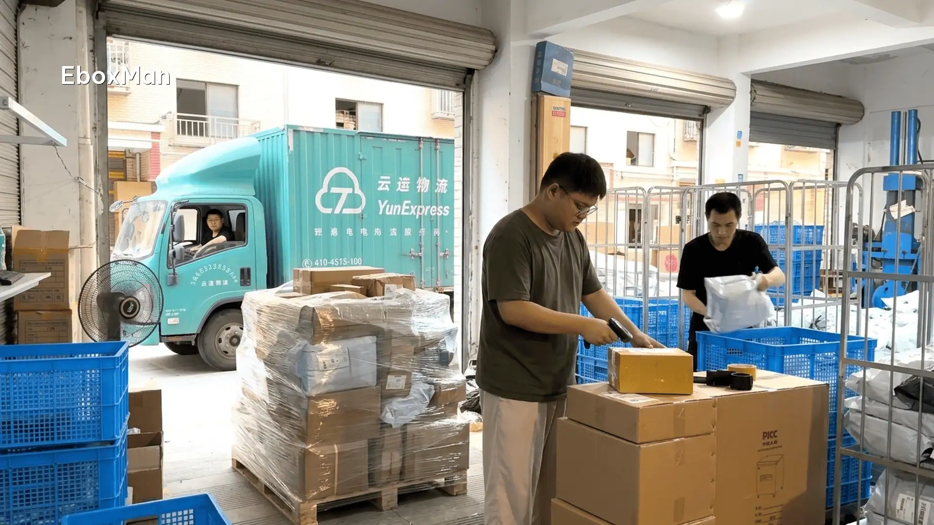 Staff scanning consolidated parcels before freight forwarder pickup