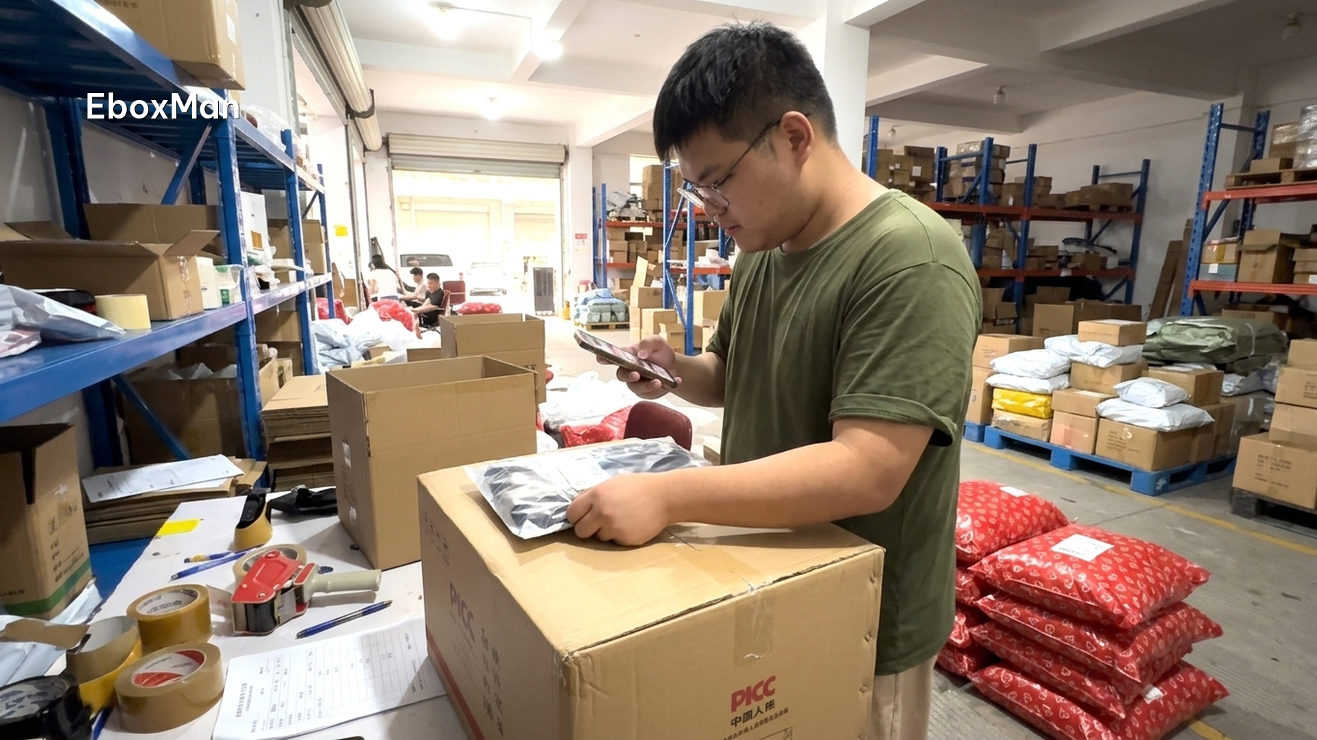 QC staff photographing a product batch before dispatch