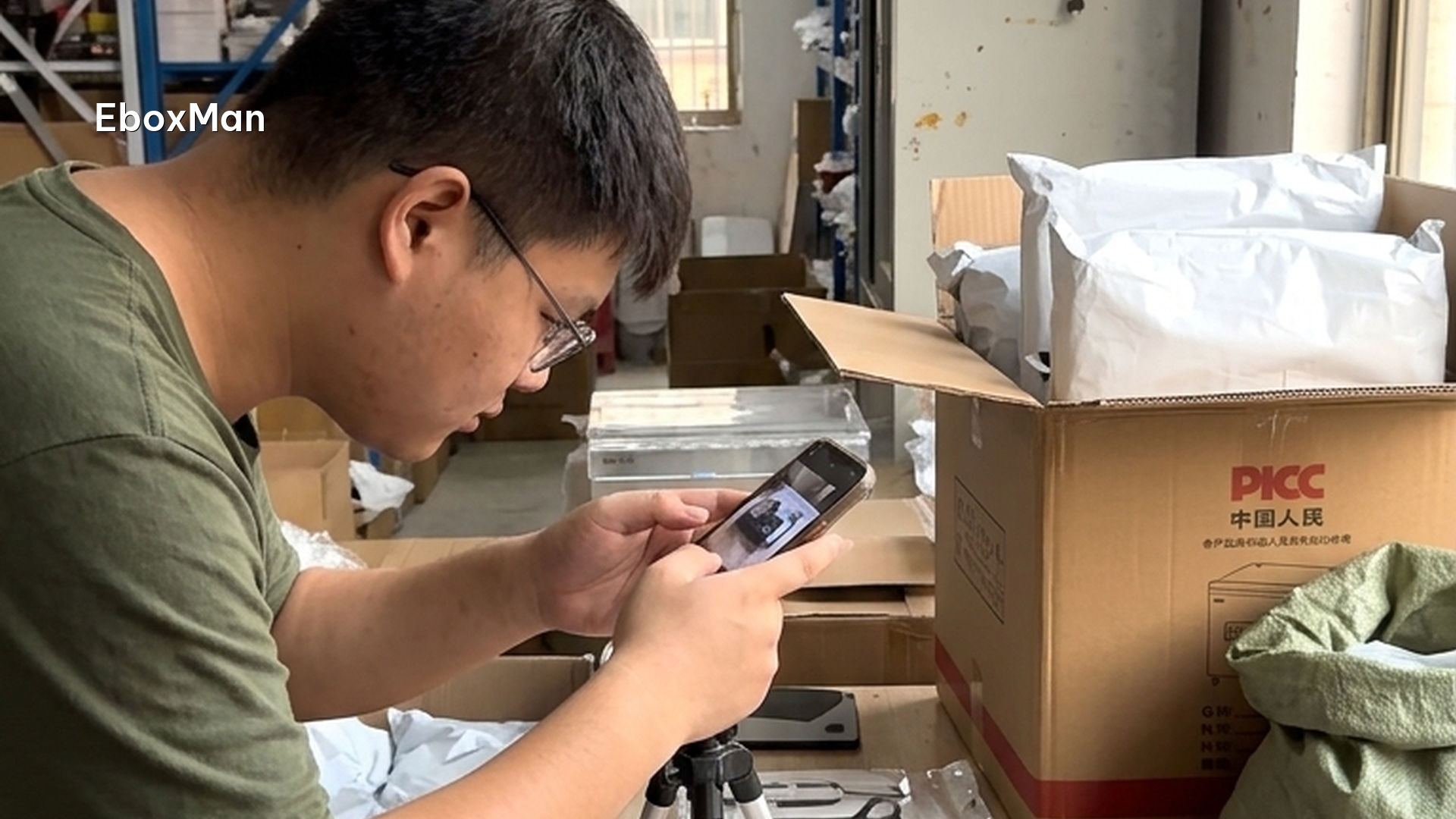 QC desk photographing a product batch before dispatch