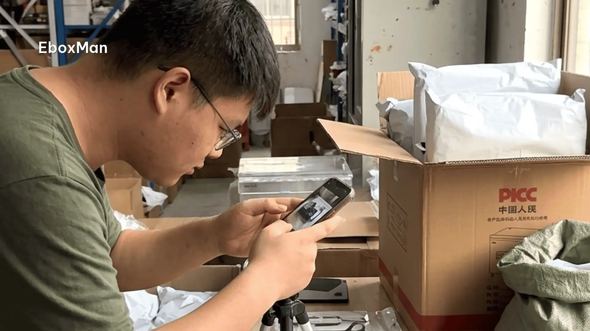 QC desk photographing a product batch before dispatch
