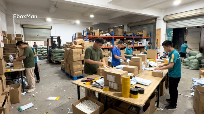 Chinese warehouse staff packing parcels during Q4 order spike