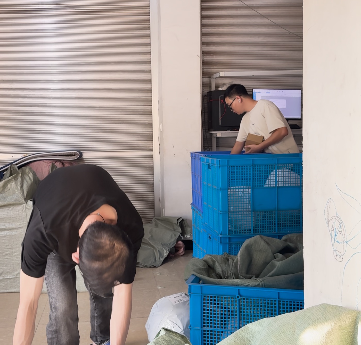 NextSmartShip alternatives in 2026: sourcing agents vs fulfillment networks 1 Parcels being sorted into crates at EboxMan's China warehouse before dispatch